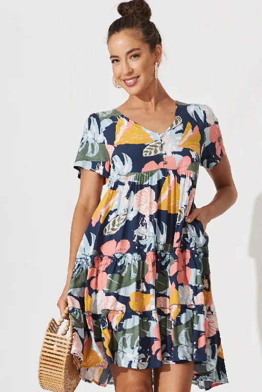 brisha-smock-dress-in-navy-with-tropical-floral