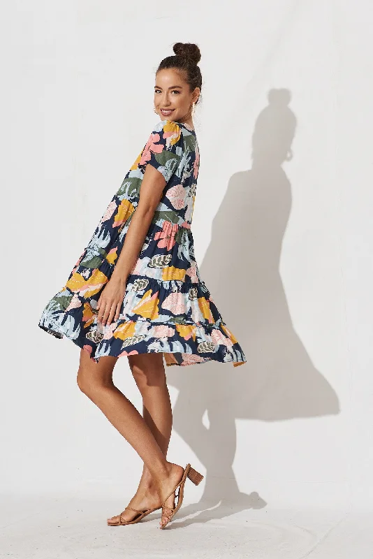 brisha-smock-dress-in-navy-with-tropical-floral