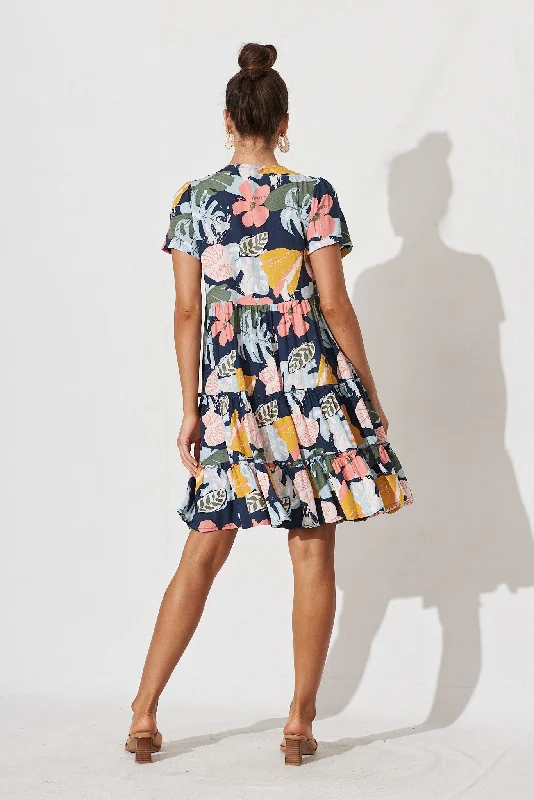 brisha-smock-dress-in-navy-with-tropical-floral